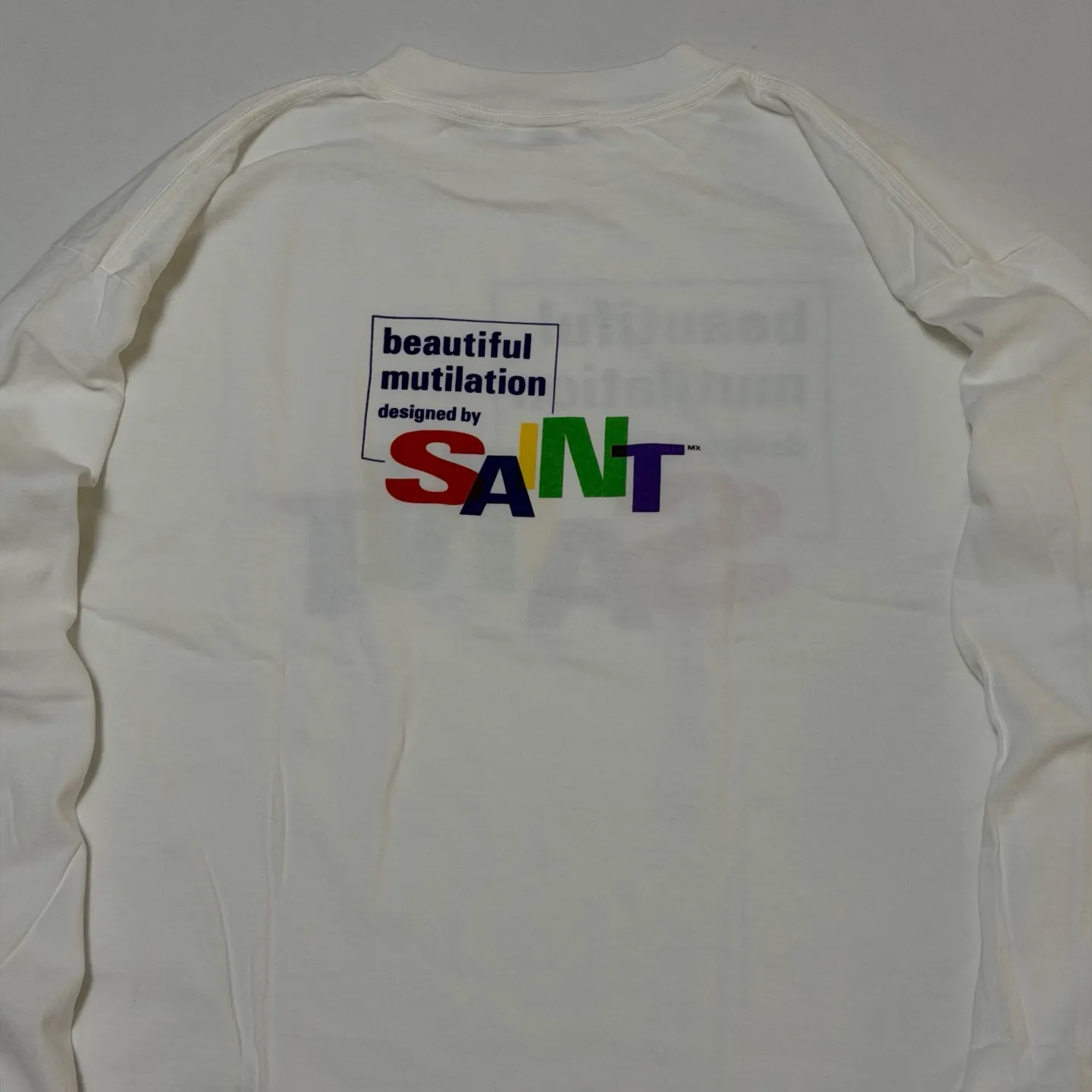 SAINT Mxxxxxx LS TEE/BEAUTIFUL SAINT/WHT Colorful SAINT slogan long-sleeved TEE White S-XL Cylindrical side seamless fabric Really made with care! Domestic printing factory OEM, original water slurry non-touch printing process, correct version, correct main mark/wash mark/little angel anti-counterfeiting mark